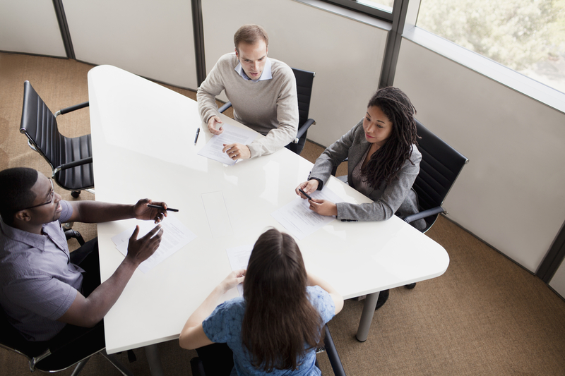 Professionals participating in a mediation and dispute resolution meeting